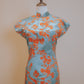 Green and orange jacquard cheongsam with pointed sleeves